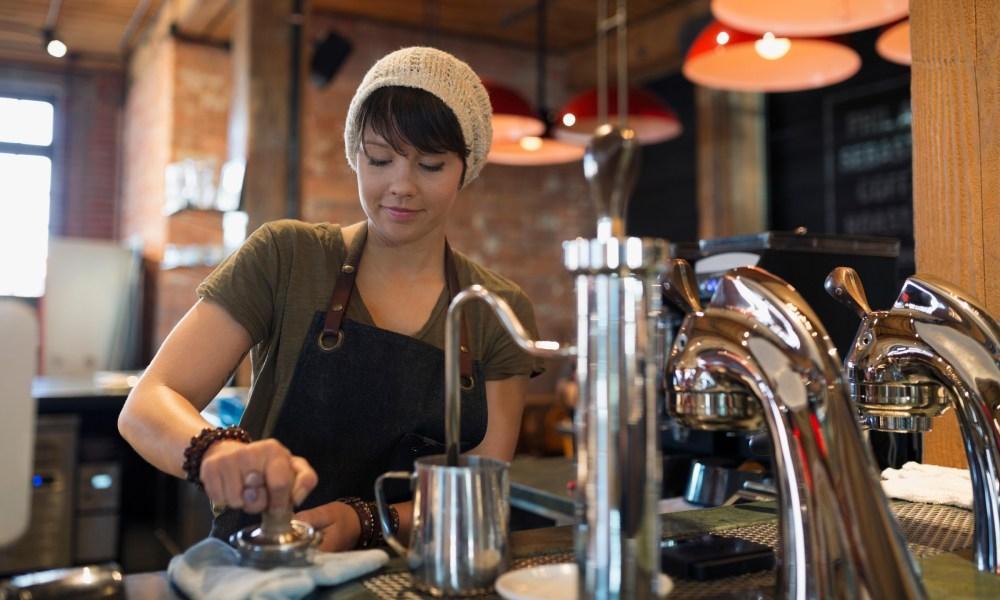 barista serving coffee 