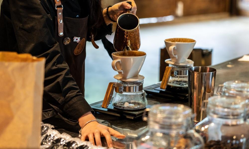 barista pouring filter coffee