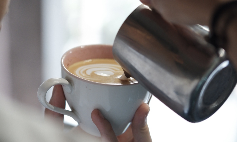 barista pouring specialty coffee